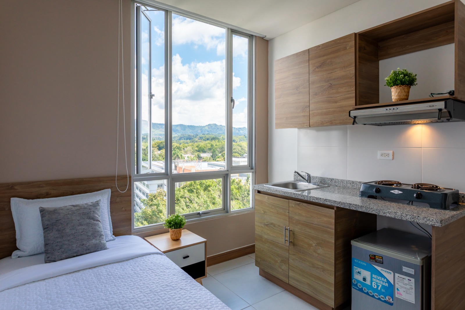Habitación Talla S de Plaza U, compacta y luminosa con cocineta